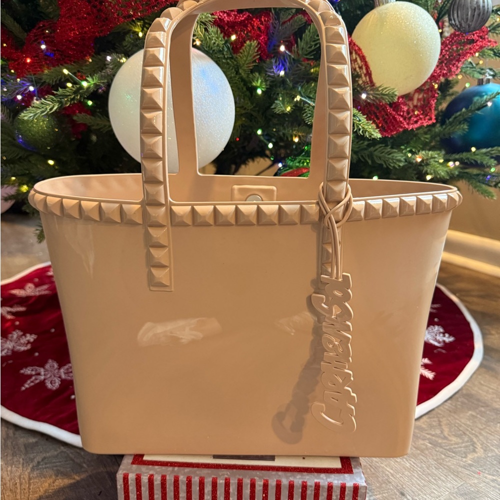 Stud-Trim Beige Tote Bag with Charm